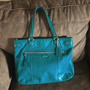 Green Coach Handbag with Large Zippered Pocket on Front amd Spacious Interior